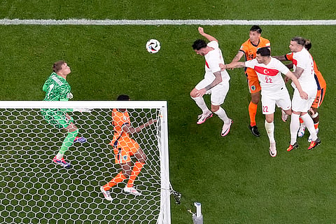 Turkey's Samet Akaydin scores the opening goal